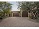 Home's exterior features a large driveway and a double garage at 23036 N Via Ventosa Dr, Scottsdale, AZ 85255