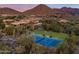 Luxury estate home with tennis court and mountain backdrop at 23036 N Via Ventosa Dr, Scottsdale, AZ 85255