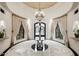 Elegant entryway with chandelier and marble flooring at 23036 N Via Ventosa Dr, Scottsdale, AZ 85255