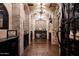 Elegant wine cellar with brick walls and wooden floors at 23036 N Via Ventosa Dr, Scottsdale, AZ 85255