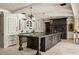 Elegant kitchen with large island, custom cabinetry, and high-end finishes throughout at 23036 N Via Ventosa Dr, Scottsdale, AZ 85255