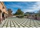 Large patio with mountain views and grassy areas at 23036 N Via Ventosa Dr, Scottsdale, AZ 85255