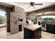 Pizza oven and grill highlight this expansive outdoor kitchen, perfect for large gatherings at 23036 N Via Ventosa Dr, Scottsdale, AZ 85255