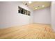 Indoor racquetball court with hardwood floors and viewing area at 23036 N Via Ventosa Dr, Scottsdale, AZ 85255