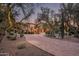 Grand estate entrance with arched driveway and landscaping at 23036 N Via Ventosa Dr, Scottsdale, AZ 85255