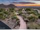 Gated entrance to a luxury estate with long driveway at 23036 N Via Ventosa Dr, Scottsdale, AZ 85255