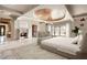 Spacious main bedroom with a large bed, fireplace, and sitting area at 23036 N Via Ventosa Dr, Scottsdale, AZ 85255