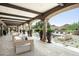 Spacious covered patio with comfortable seating and mountain views at 23036 N Via Ventosa Dr, Scottsdale, AZ 85255