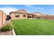 Spacious backyard with lush grass and block wall at 22882 E Marsh Rd, Queen Creek, AZ 85142