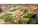 Community view with homes, golf course, and mountain backdrop at 20622 W Colter St, Buckeye, AZ 85396