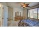 Bright bedroom with double dresser, ceiling fan and window coverings at 392 W Twin Peaks Pkwy, San Tan Valley, AZ 85143