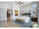Main bedroom features a brick accent wall and ample natural light at 19974 E El Nido Ln, Litchfield Park, AZ 85340