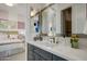 Elegant bathroom with gray cabinets and a quartz countertop at 19974 E El Nido Ln, Litchfield Park, AZ 85340