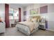 Charming bedroom with pink and purple accents and a comfy bed at 19974 E El Nido Ln, Litchfield Park, AZ 85340
