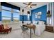 Spacious bedroom with a built-in desk and large windows at 19974 E El Nido Ln, Litchfield Park, AZ 85340