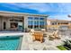 Inviting backyard oasis with a sparkling pool and outdoor kitchen at 19974 E El Nido Ln, Litchfield Park, AZ 85340