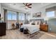 Secondary bedroom with wood floors and a ceiling fan at 19974 E El Nido Ln, Litchfield Park, AZ 85340