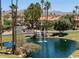 Attractive pond with fountain, landscaping and mountains at 9707 E Mountain View Rd # 1414, Scottsdale, AZ 85258