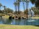 Serene pond with fountain and swan in a community setting at 9707 E Mountain View Rd # 1414, Scottsdale, AZ 85258