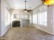 Spacious living area featuring a fireplace and tiled floors at 28352 N 124Th Dr, Peoria, AZ 85383