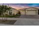 Beautiful home with two-car garage and landscaped front yard at 22855 E Twilight Dr, Queen Creek, AZ 85142