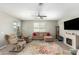 Spacious living room with tile floors, a fireplace, and neutral decor at 1966 W Larissa Ln, San Tan Valley, AZ 85144