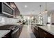 Modern kitchen featuring stainless steel appliances and granite countertops at 3454 E Jasmine Way, San Tan Valley, AZ 85143