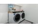 Laundry room with washer, dryer, and shelving for storage at 3454 E Jasmine Way, San Tan Valley, AZ 85143