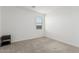 Bright bedroom with carpeted floor, window with blinds, and a nightstand at 3454 E Jasmine Way, San Tan Valley, AZ 85143