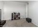 Simple bedroom with a bookshelf and a comfortable ottoman at 3454 E Jasmine Way, San Tan Valley, AZ 85143