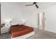 Spacious bedroom with a queen bed and access to a hallway at 3454 E Jasmine Way, San Tan Valley, AZ 85143