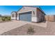 New construction home with gray garage and desert landscaping at 3454 E Jasmine Way, San Tan Valley, AZ 85143