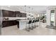Modern kitchen with island, dark cabinets, and granite countertops at 3454 E Jasmine Way, San Tan Valley, AZ 85143
