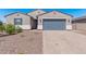 Modern two-story home with gray garage door and landscaping at 3454 E Jasmine Way, San Tan Valley, AZ 85143