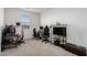 Home office with a desk, two chairs, and a large TV at 3454 E Jasmine Way, San Tan Valley, AZ 85143