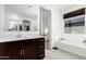 Clean bathroom with a soaking tub and a double vanity at 3454 E Jasmine Way, San Tan Valley, AZ 85143