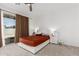 Bright bedroom with a queen bed and direct access to the backyard at 3454 E Jasmine Way, San Tan Valley, AZ 85143
