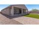Artificial turf backyard with covered patio and paver walkway at 3454 E Jasmine Way, San Tan Valley, AZ 85143