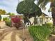 Charming single-wide home with lush landscaping and a relaxing patio area at 17200 W Bell Rd # 2228, Surprise, AZ 85374