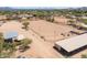 Aerial view of riding arena, stables, and surrounding landscape at 1525 W Maddock Rd, Phoenix, AZ 85086