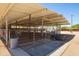 Covered horse stables with water troughs and shaded area at 1525 W Maddock Rd, Phoenix, AZ 85086