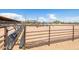 Metal feed bunks along the arena fence at 1525 W Maddock Rd, Phoenix, AZ 85086