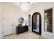 Bright entryway with an arched door and tile flooring at 38306 N 108Th St, Scottsdale, AZ 85262