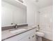 Clean bathroom with white vanity, granite countertop and bathtub at 4545 N 67Th Ave # 1242, Phoenix, AZ 85033