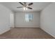 Bright bedroom with ceiling fan and large window at 812 E Agua Fria Ln, Avondale, AZ 85323