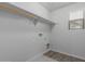 Laundry room with built-in shelving and window at 812 E Agua Fria Ln, Avondale, AZ 85323