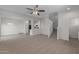 Open-concept living room with adjacent kitchen and dining area at 812 E Agua Fria Ln, Avondale, AZ 85323