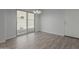 Dining area with wood-look flooring and sliding glass door to patio at 812 E Agua Fria Ln, Avondale, AZ 85323