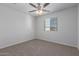 Bedroom featuring a ceiling fan and window with blinds at 812 E Agua Fria Ln, Avondale, AZ 85323