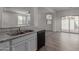 Kitchen with view into living area and backyard access at 812 E Agua Fria Ln, Avondale, AZ 85323